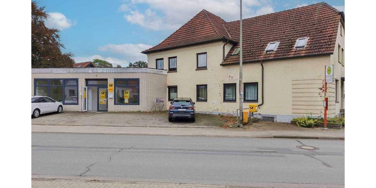 Saniersbedürftiges 12 Zimmer-Einfamilienhaus mit anliegender Gewerbeeinheit 1 zimmer