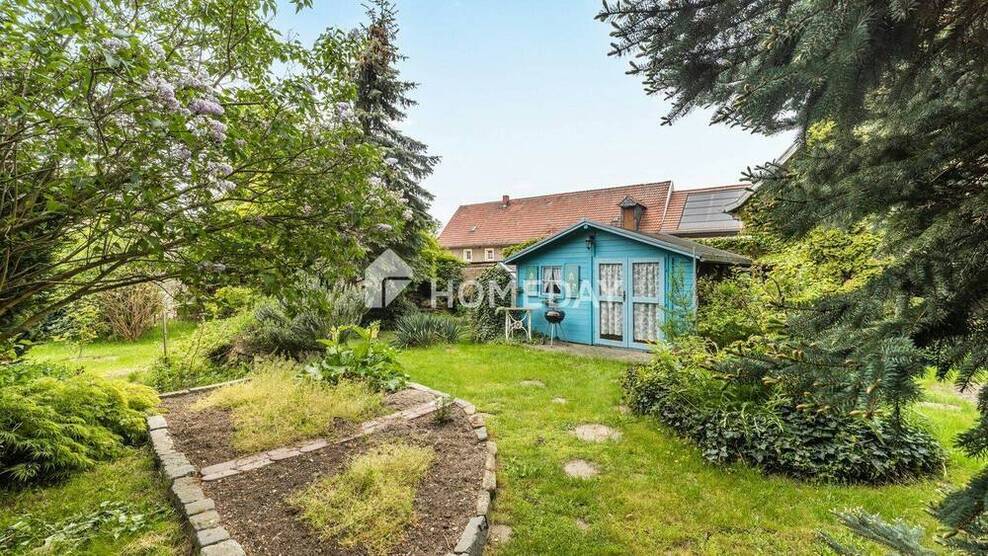Geräumiges Haus mit 792 m² Nutzfläche, Scheune für 10 Fahrzeuge, Gartenparadies und Ausbaureserve