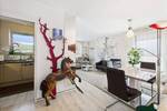 Lichtdurchflutete 3-Zimmer-Wohnung mit umfassender Dachterrasse und Tiefgaragenstellplatz