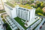 DONAU SIDE: Modernes Studio Apartment mit Terrasse, Fitnessstudio & Co-Working zimmer