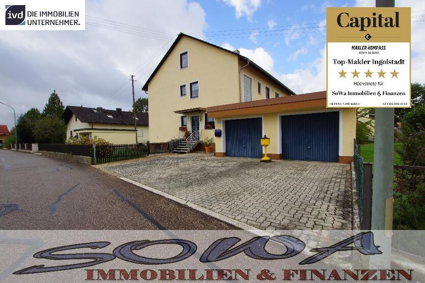 Attraktives Zweifamilienhaus mit zwei Garagen aus einem großzügigen Grundstück - Ein Objekt von Ihrem Immobilienpartner SOWA Immobilien und Finanzen