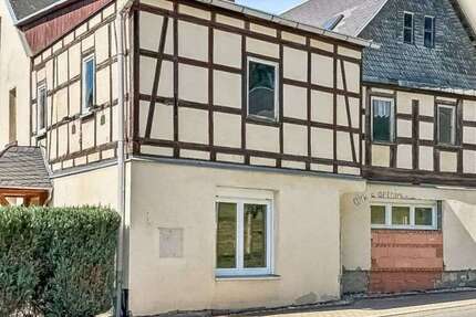 Haus zum Kaufen in Mohlsdorf-Teichwolframsdorf 58.500 € 180 m² 7 zimmer