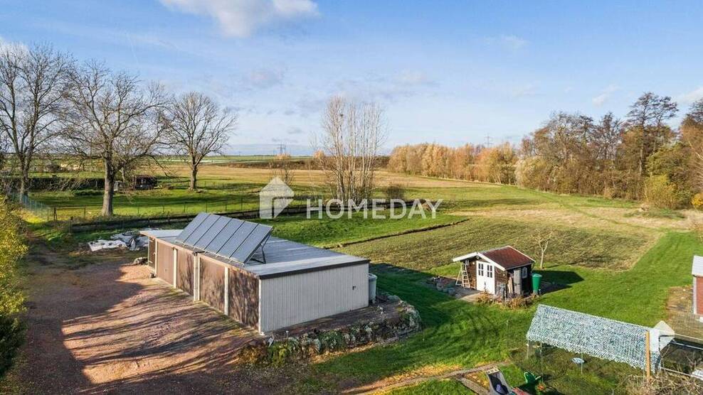 Idyllisches EFH mit EinliegerWohnung, großem Grundstück, Terrasse und 4 Garagen in Milzau