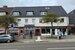 Wohn- und Geschäftshaus mit 3 Ladengeschäften, 4 Wohnungen und 3 Garagen in Lübeck-Kücknitz