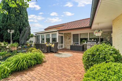 Stilvoller Bungalow mit Wintergarten & Kamin – Wohnen auf einer Ebene in idyllischer Lage - Haus Rheine / Elte Rheine | Angebot:26781763