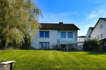 Einfamilienhaus mit Einliegerwohnung und traumhaftem, sonnigem Garten in ruhiger Lage 5 zimmer