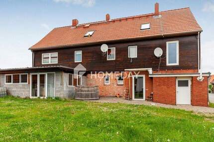 Charmantes Mehrfamilienhaus mit zwei Wohneinheiten, Garage, Carport und großzügigem Garten 8 zimmer