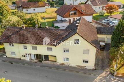 Großzügiges Mehrfamilienhaus mit drei Wohneinheiten + Gewerbe und idyllischem Garten 1 zimmer
