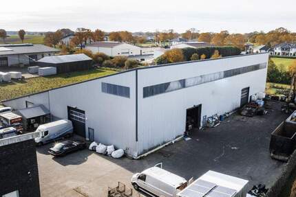 **Vielseitige Industriehalle mit 1.700 m² und vollständig vermieteten Garagen** zimmer