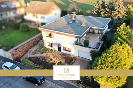 Repräsentativer Bungalow mit Einliegerwohnung, Doppelgarage + großer Terrasse in Toplage von Karben 8 zimmer