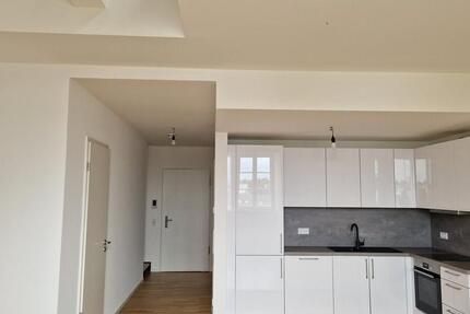 Zentrumsnahe Galeriewohnung mit Einbauküche und Tiefgarage 2 zimmer