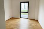 Helle 2-Zimmer-Wohnung mit Terrasse, moderne Neubau-Ausstattung mit Echtholzparkett + Einbauküche