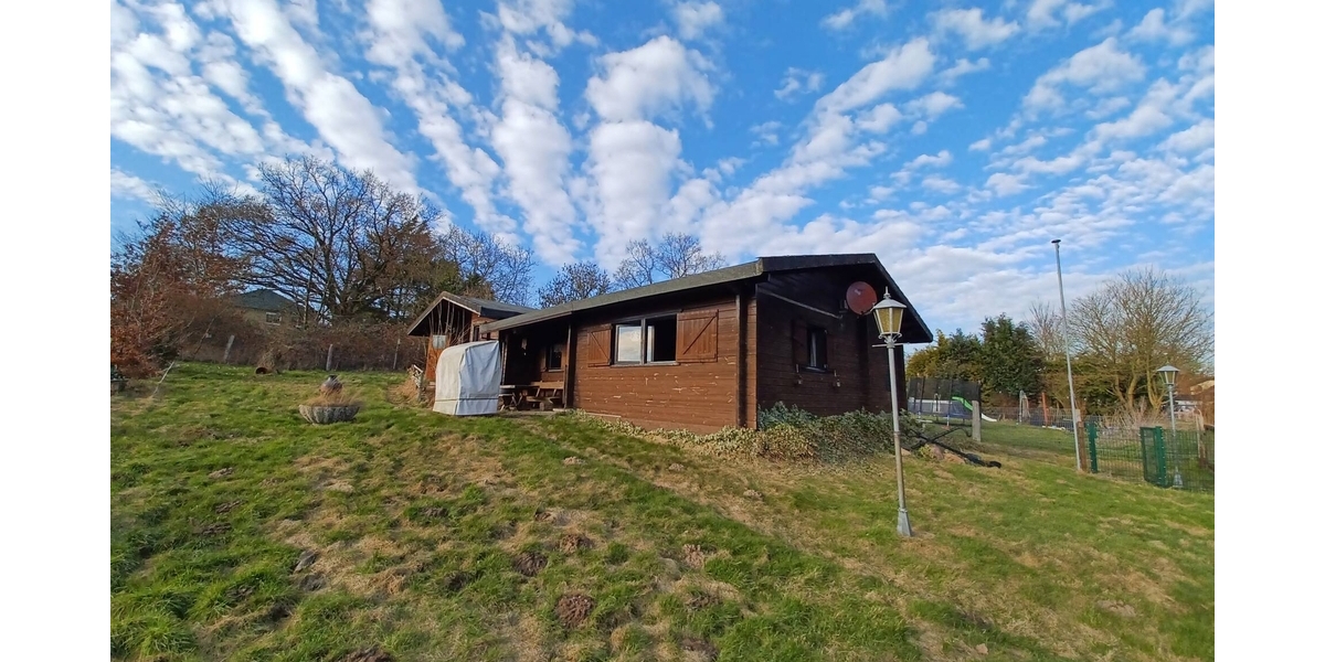 2 Blockbohlenhäuser mit ca. 1.000 m² Eigenland und traumhaftem Ausblick zum günstigen Preis! - Zweifamilienhaus Zarpen | Angebot:26006779